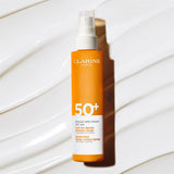 Clarins NEW Body Sunscreen Lotion Spray | Broad Spectrum SPF 50+ | UVA/UVB Protection | Lightweight and No White Cast | Enriched with Antioxidants | All Skin Types, including Sensitive Skin | 5 Ounces